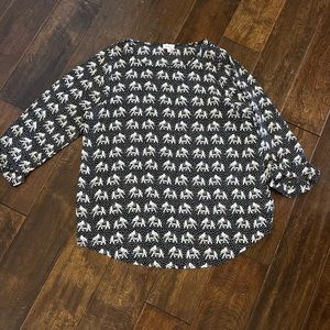 Black and cream blouse with the most fun print